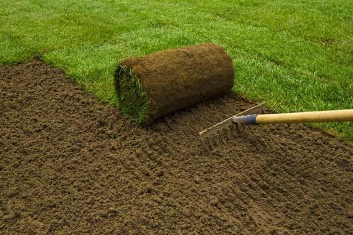 sod installation in st cloud, Florida with rake and dirt